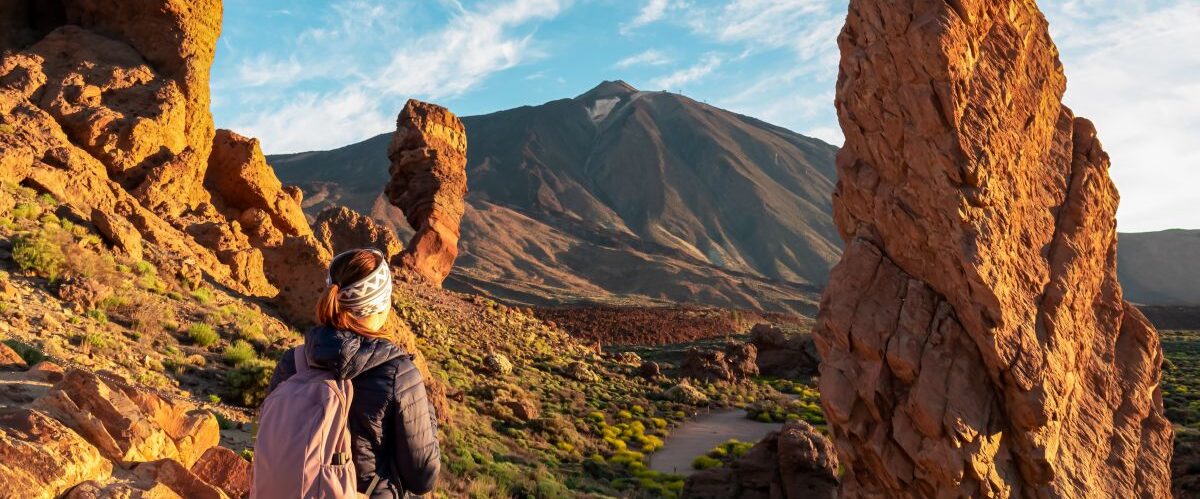 Woman,With,Backpack,Hiking,With,Scenic,Golden,Hour,Sunrise,Morning
