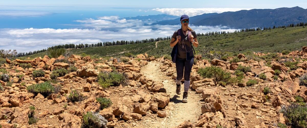 Front,View,Of,Woman,On,Hiking,Trail,To,Riscos,De