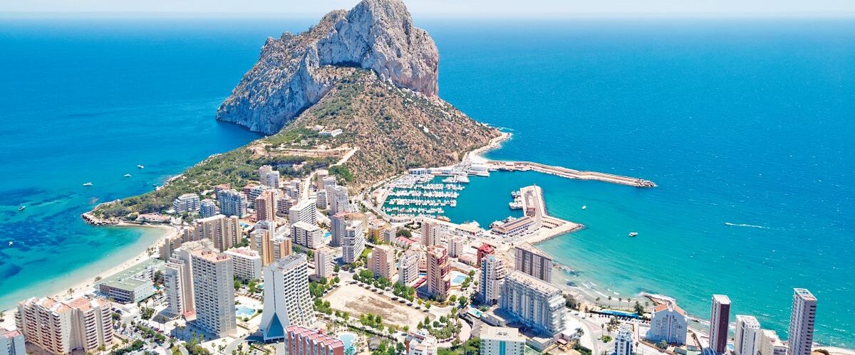 High Angle View Of Buildings By Sea Against Sky
