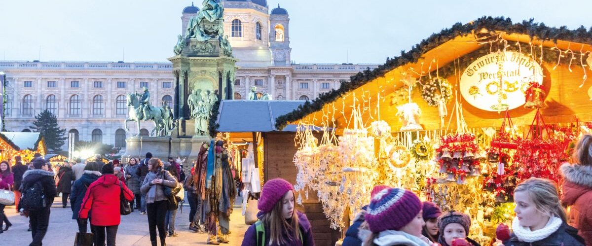 Christmas market at Maria Theresien Platz at dusk in Vienna, Austria