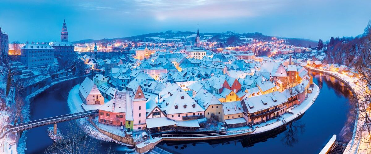 Panoramic view of Cesky Krumlov in winter season, Czech Republic. View of the snow-covered roofs. Travel and Holiday in Europe. Christmas time. Historical houses and streets. UNESCO World Heritage