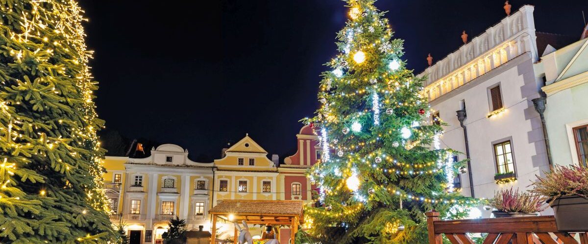 Cesky Krumlov, Czech Republic - December 4, 2019: Christmas market in old town of Cesky Krumlov with a lot of decorations and lights.